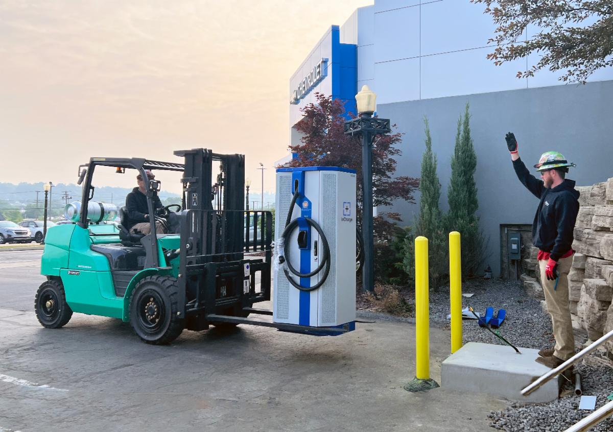 Public Electric Vehicle (EV) charging stations in a public parking lot.