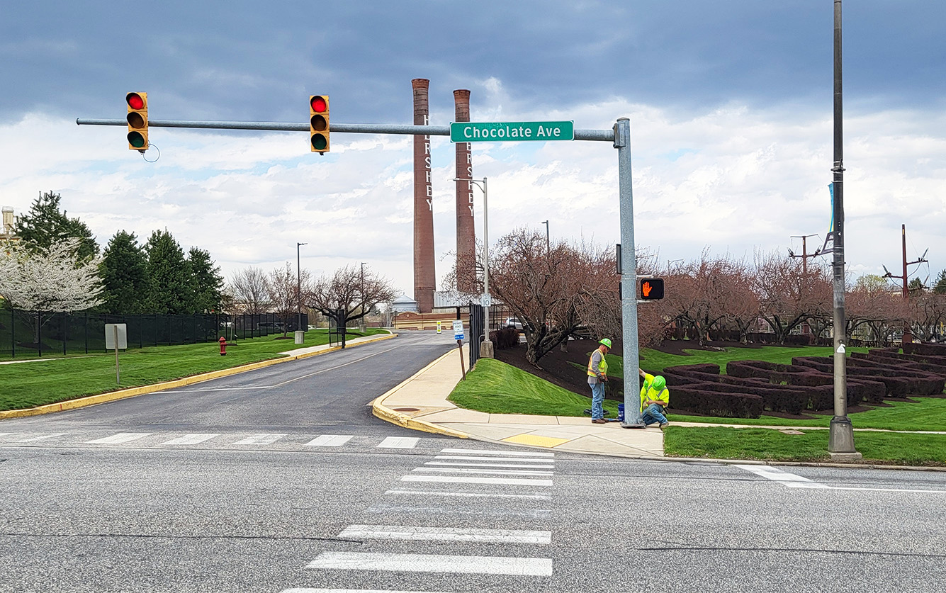 Bruce & Merrilees union electricians install and test pedestrian signal at Chocolage Avenue in Hershey PA