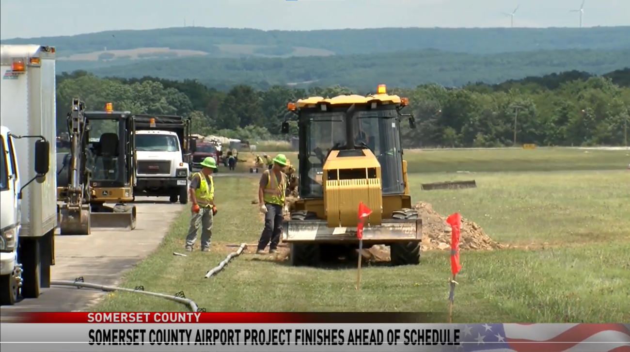 Trencher along side of airport runway