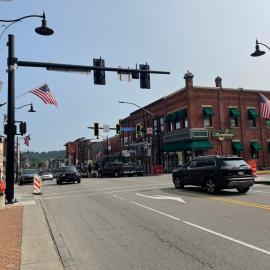 Traffic passes under new decorative traffic poles at Butler intersection