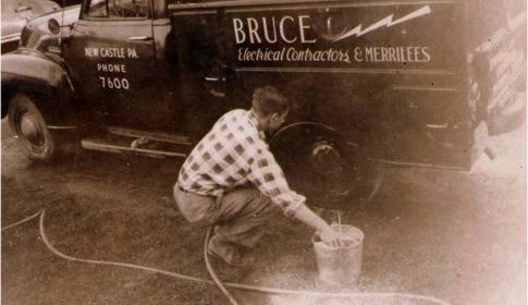 Bob Cather washes B&amp;M company truck, circa 1949