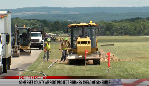 Trencher along side of airport runway