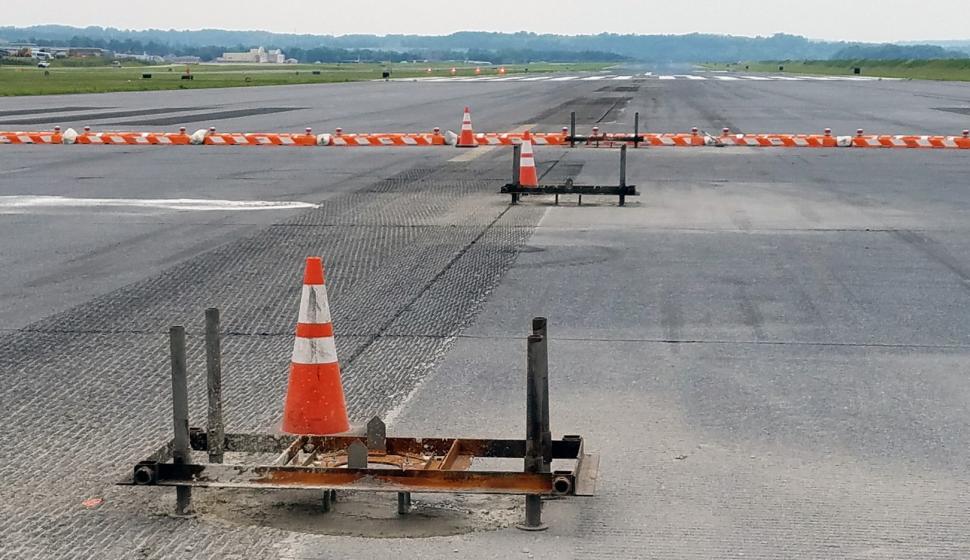 Cones mark the site of freshly poured concrete foundations