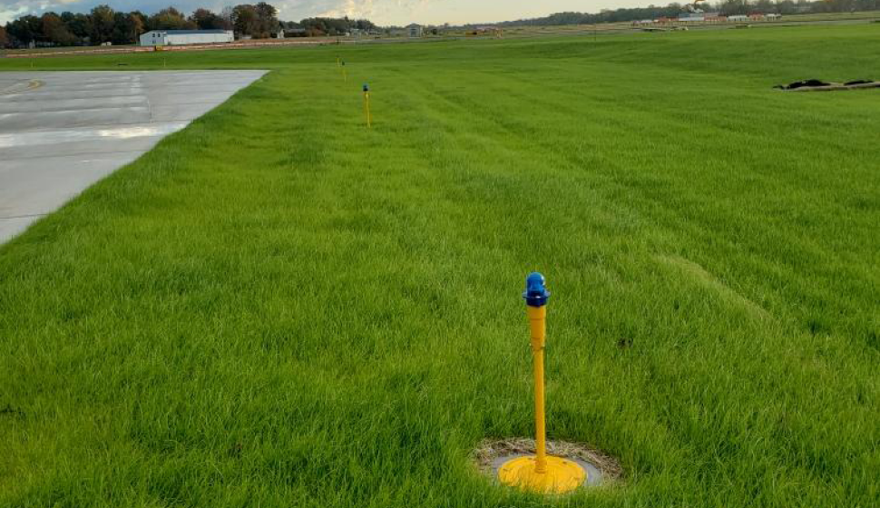 Airfield lighting in row in grass