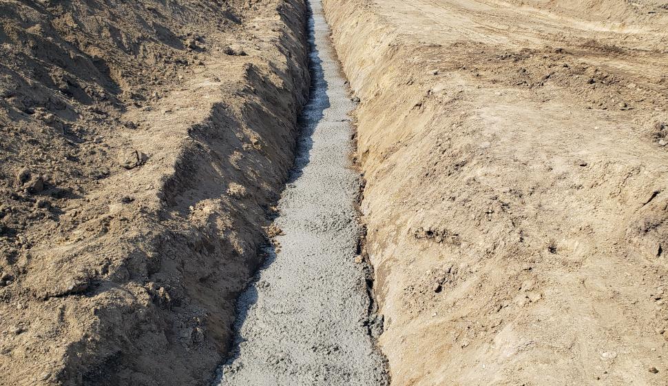 Long view of concrete covered trench