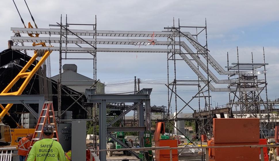 cable tray erected on scaffolding in lieu of vertical supports