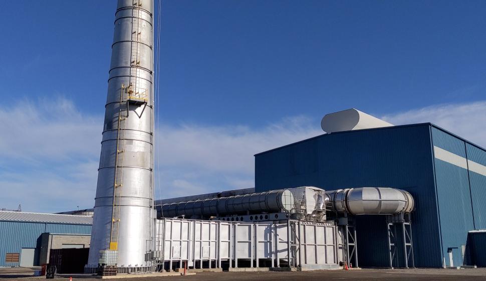 Exterior of completed walking beam furnace building and smokestack