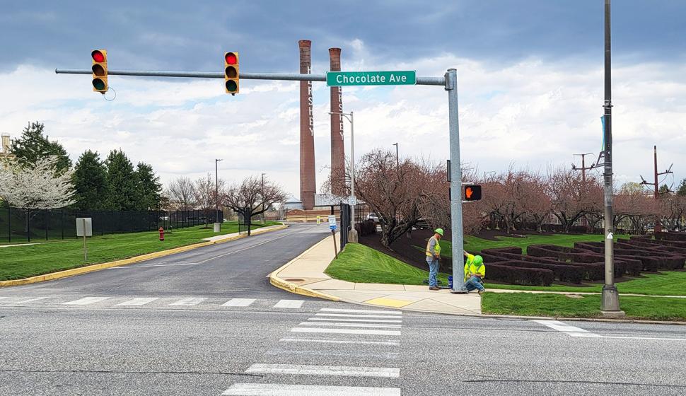 Bruce & Merrilees union electricians install and test pedestrian signals along Chocolate Avenue in Hershey, PA